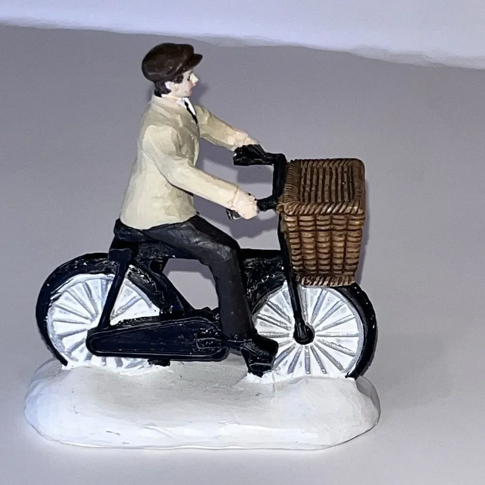2 Christmas‎ Village Ceramic Figurines Man On Bicycle & Christmas In City Sign